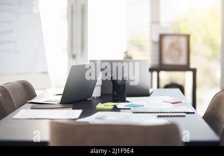 Big plans are made here. Still life shot of laptops and paperwork on a table in a modern office. Stock Photo