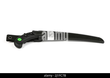 Folding garden saw in the folded state isolated on a white background, pocket saw. High resolution photo. Full depth of field. Stock Photo