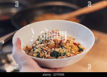 Orzo with vegetables and meat Stock Photo