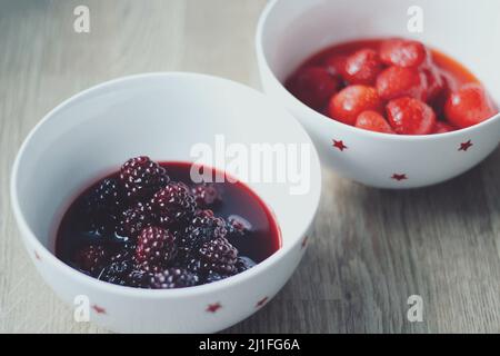 Blackberries and strawberries in a bowl Stock Photo