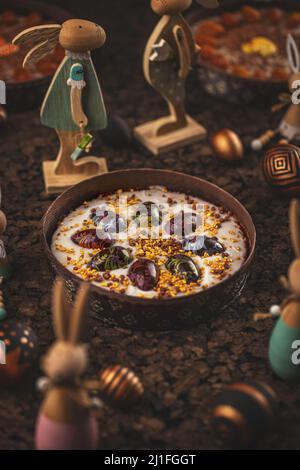 Carrot Easter cake with frosting and small chocolate eggs on top. Easter concept. Stock Photo