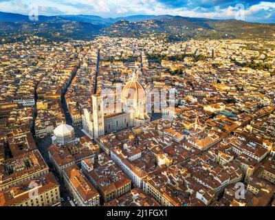 Aerial view of Florence cathedral, view of the Duomo with its Brunelleschi designed dome sited in the center of the city of Florence against Tuscany h Stock Photo