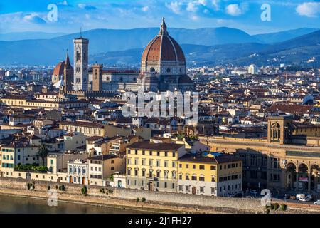 Florence cathedral, view of the Duomo with its Brunelleschi designed dome sited in the center of the city of Florence against Tuscany hills, Italy  Th Stock Photo