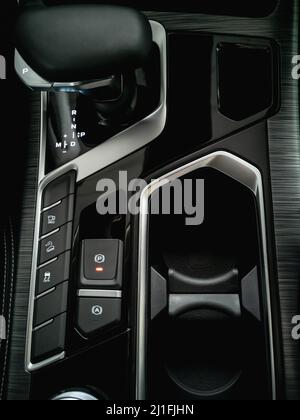 Automatic transmission in a modern car. Photo close-up from above. Vertical photo. Stock Photo