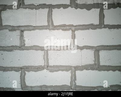 Masonry from gas silicate blocks. Construction of walls and partitions of houses. Horizontal photo. Stock Photo