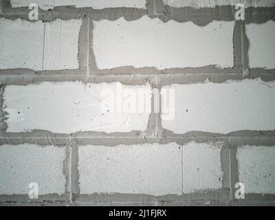 Construction of walls and partitions of houses. Masonry from gas silicate blocks. Horizontal photo. Stock Photo