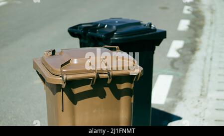 Two garbage cans on the street Stock Photo