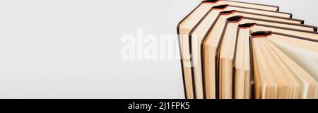 close up view of open books isolated on grey with copy space, banner Stock Photo
