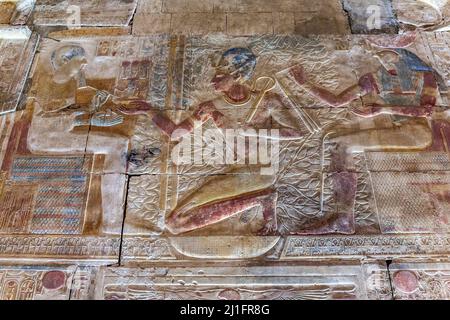 King Seti I receiving the crook and flail from Ra in the Great Temple of Abydos, Egypt Stock Photo