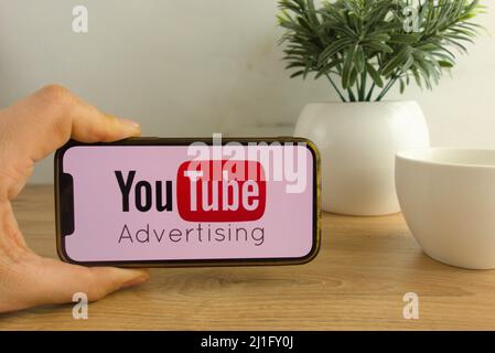 KONSKIE, POLAND - March 20, 2022: Youtube Advertising logo displayed on mobile phone. Social media marketing concept Stock Photo