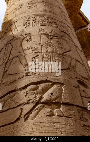 Carved inscriptions on one of the gigantic pillars in the Great Hypostyle Hall at Karnak Stock Photo