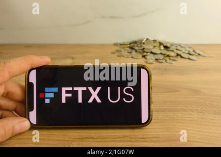 KONSKIE, POLAND - March 20, 2022: FTX US cryptocurrency exchange logo on mobile phone. Online trading, blockchain technology concept Stock Photo