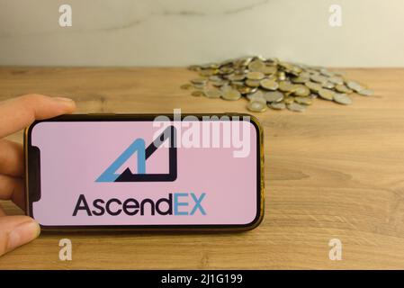 KONSKIE, POLAND - March 20, 2022: AscendEX cryptocurrency exchange logo on mobile phone. Online trading, blockchain technology concept Stock Photo