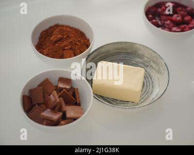 bakery, food and people concept. ingredients for making chocolate pie or cake Stock Photo