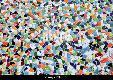 Closeup of ceramic mosaic with countless multicolored tiles with different shapes form a coherent overall picture Stock Photo