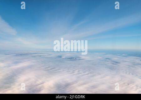 Blue sky above the clouds. Stock Photo