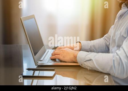 Businessman working from home and using his laptop. Telework concept Stock Photo