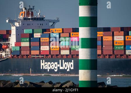 Container cargo ship Al Manamah, owned by Hapag-Lloyd, in the harbor entrance of the deep-sea port Maasvlakte 2, the seaport of Rotterdam, Netherlands Stock Photo