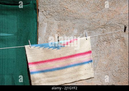 Adobe home uses the old fashioned way to dry clothes, on a clothesline ...