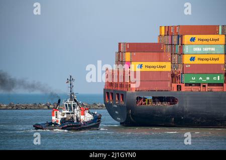 Container cargo ship Al Manamah, owned by Hapag-Lloyd, in the harbor entrance of the deep sea port Maasvlakte 2, the seaport of Rotterdam, Netherlands Stock Photo