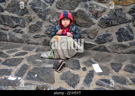 Kabul, Afghanistan. 22nd Feb, 2022. (2/22/2022) Kabul, Afghanistan, February March 2022, Pioverty is rife. Child working as shoeshine boy and begging on the street. (Photo by Teun Voeten/Sipa USA) Credit: Sipa USA/Alamy Live News Stock Photo