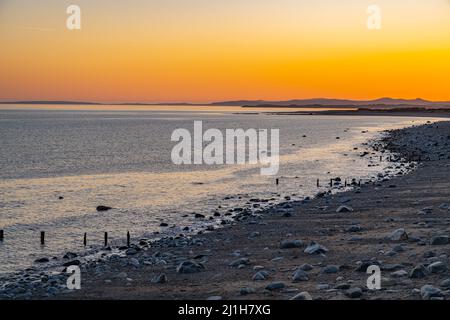 Sunset over the sea, from the seafront at Criccieth North Wales Stock Photo