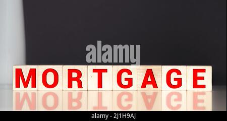 MORTGAGE word on wooden block. Business concept Stock Photo