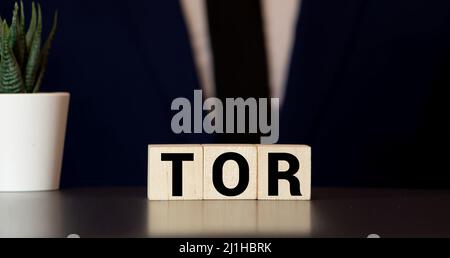 Tor anonymous by letters on a woden blocks on black. Business concept Stock Photo