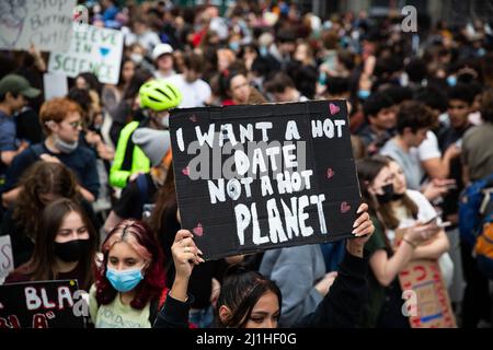 New York, USA. 25th Mar, 2022. A teen holds sign in crowd reading, "I want a hot date not a hot planet" during the demonstration. Over a thousand youth climate activists marched from Brooklyn Borough Hall across the Brooklyn Bridge to Foley Square as part of a global climate strike. Credit: SOPA Images Limited/Alamy Live News Stock Photo