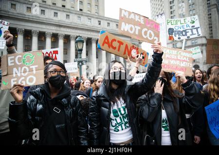 New York, USA. 25th Mar, 2022. Protesters hold climate activism signs during the demonstration. Over a thousand youth climate activists marched from Brooklyn Borough Hall across the Brooklyn Bridge to Foley Square as part of a global climate strike. Credit: SOPA Images Limited/Alamy Live News Stock Photo