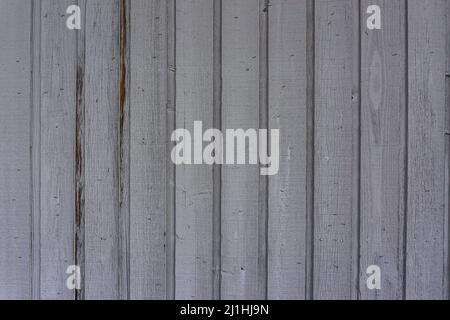 White and brown wall decaying wood vertical lines with an old paint job. Stock Photo