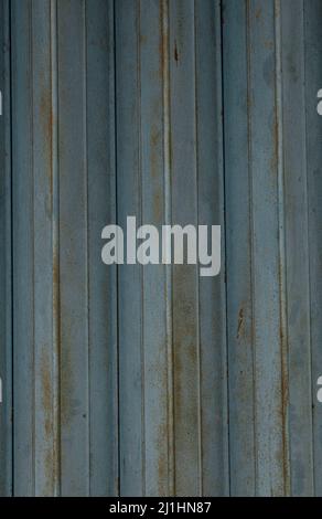 Rusted blue corrugated metal surface or galvanize steel in the vertical line background or texture Stock Photo