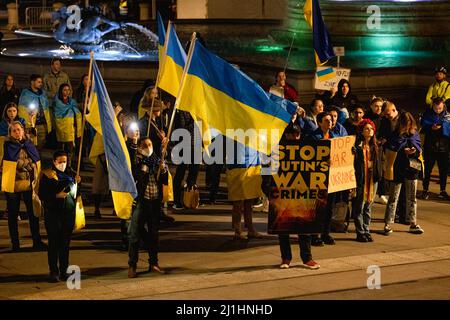 London, UK. 25th Mar, 2022. Demonstrators hold flags and placards in support of Ukraine during the demonstration. Demonstrations in support Ukraine have been ongoing on an everyday basis in London since the Russia-Ukraine War started on 24th February 2022. Participants demand NATO to close the air space above Ukraine to stop Russia from bombing the country. (Photo by Hesther Ng/SOPA Images/Sipa USA) Credit: Sipa USA/Alamy Live News Stock Photo