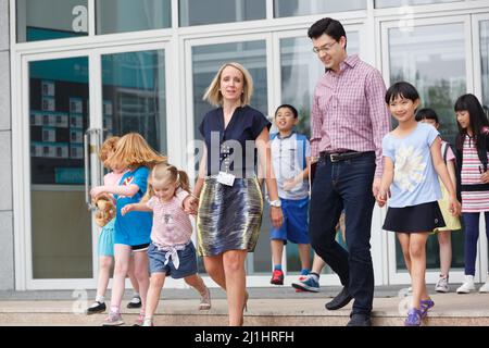 Teachers and pupils in the classroom Stock Photo