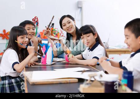 The teacher and students in the class Stock Photo