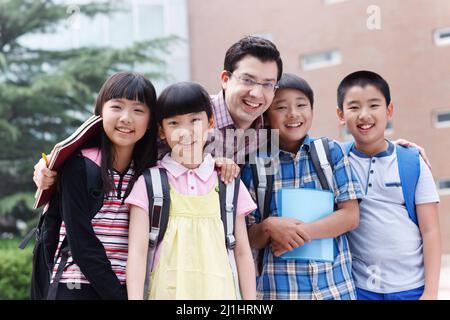 The teacher and students in the class Stock Photo