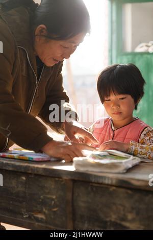 Rural female teachers and pupils in the classroom Stock Photo - Alamy