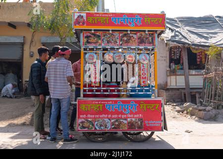 Barsana, Uttar Pradesh, India - March 2022:Portrait on Indian people with colorful faces celebrating the colorful holi festival on the streets of bars Stock Photo