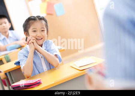 Elementary school students in the classroom Stock Photo
