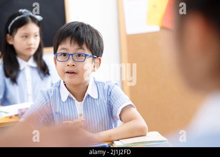 Elementary school students in the classroom Stock Photo
