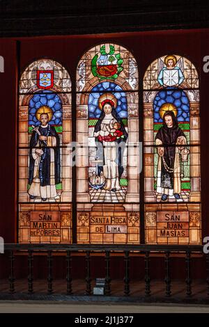 A vertical shot of a religious glass window inside Santo Domingo convent in downtown Lima, Peru Stock Photo