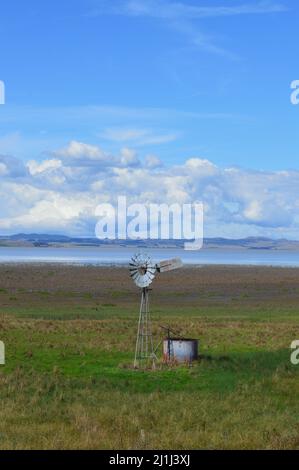 A windmill by Lake George in New South Wales, Australia Stock Photo