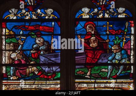 Roman guards reel in shock and disbelief as Jesus steps out of his tomb on the third day after his crucifixion: two panels of colourful Renaissance stained glass in 16th century Resurrection window in the Église Saint-Rémi at Ceffonds, in the Haute-Marne of the Champagne region of northeast France. Stock Photo