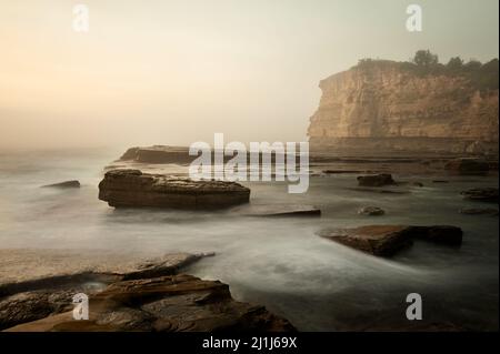 Morning ocean fog at the Skillion in Terrigal. Stock Photo