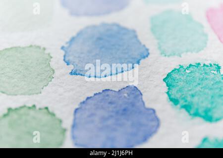 Aquarelle background with paper texture. Blue and green stains of watercolor paint. Abstract background with blue watercolor blots. Stock Photo