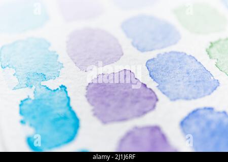 Watercolor spots. Blue and lilac stains of watercolor paint. Aquarelle background with paper texture. Abstract shape with brush strokes Stock Photo