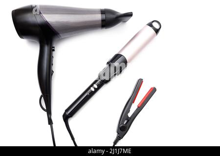 Different electronic tools for hair styling on white background Stock Photo