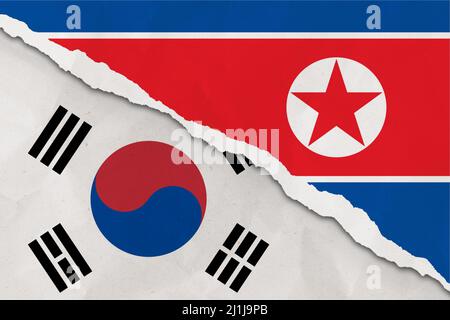 South Korea and North Korea flag ripped paper grunge background. Abstract South Korea and North Korea economics, politics conflicts, war concept textu Stock Photo