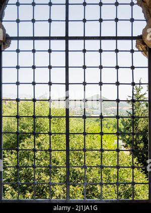 window with iron and rods. Barred window in ancient theatre Building. Selective Focus. Stock Photo