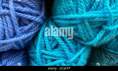Blue and dark blue range of wool yarn. Multicolored skeins of wool close-up Stock Photo